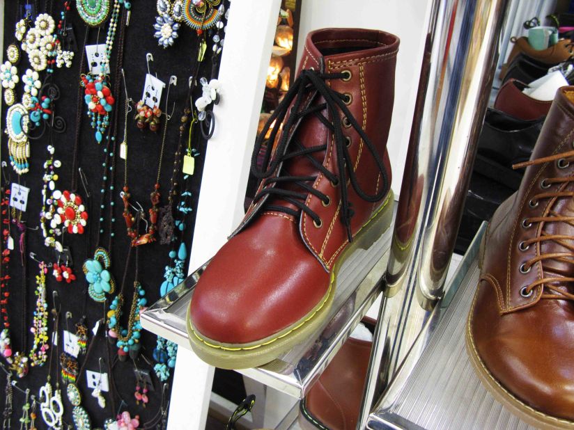 In an air-conditioned, multi-level mall in Bangkok, a sign deceptively advertises "Dr. Martens" next to boots resembling the real thing, but without any logos on the leather or soles.