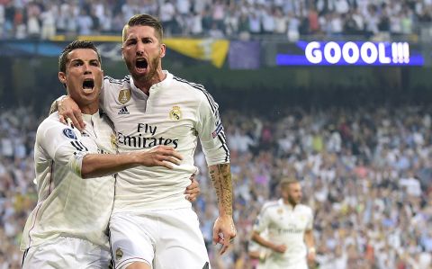 Ronaldo celebrates with teammate Sergio Ramos after scoring his 10th goal in this season's competition and 77th overall in the Champions League -- matching rival Lionel Messi on both counts. 