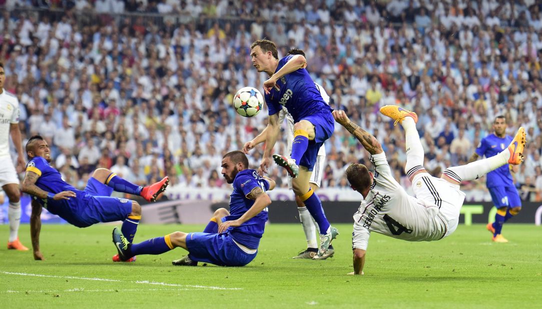 The match produced some frantic action -- here Ramos (right) launches a spectacular kick past Juventus' Leonardo Bonucci, Stephan Lichtsteiner and Arturo Vidal.