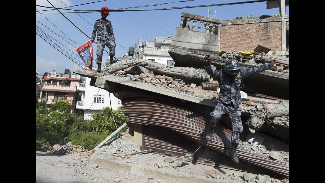 Nepali rescue team members work at a collapsed building in Kathmandu on May 14.