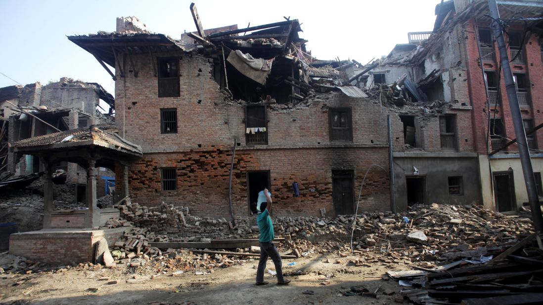 A man carries a jug of water in Bhaktapur, Nepal, on May 14.