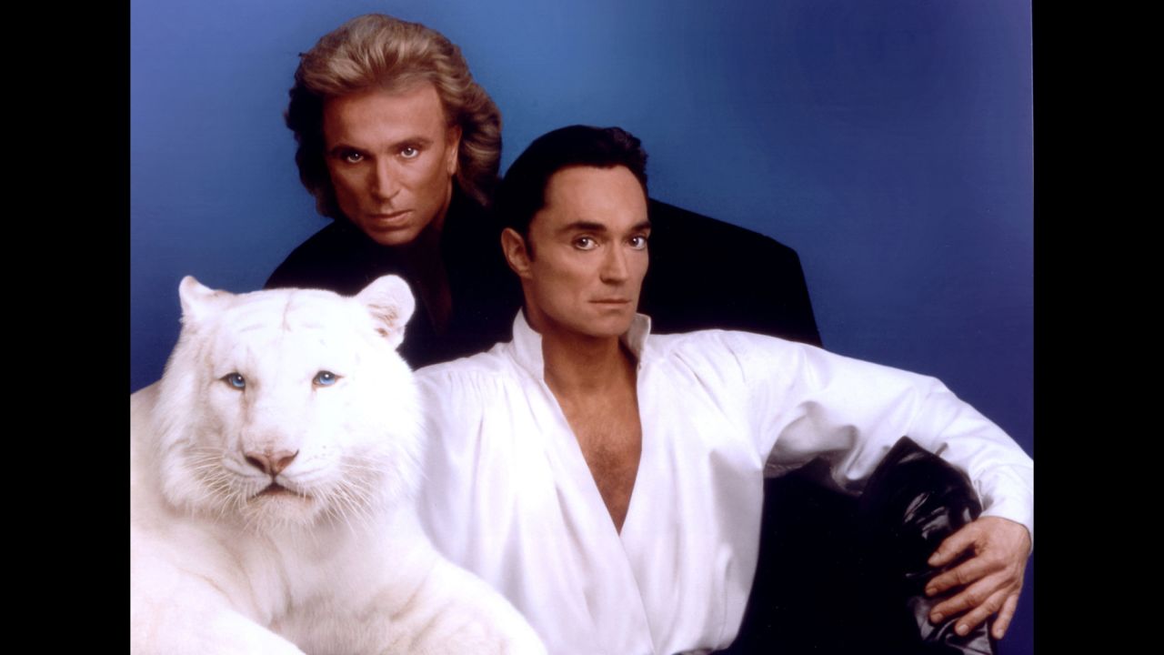 Illusionists Siegfried and Roy pose with their white tiger in this undated photo at The Mirage casino hotel in Las Vegas. <a href="http://cnn.com/2014/03/26/showbiz/siegfried-roy-tiger/">A tiger lunged at Roy Horn's neck</a> halfway through a sold-out performance in October 2003, putting the entertainer in a critical condition, but thankfully he survived.