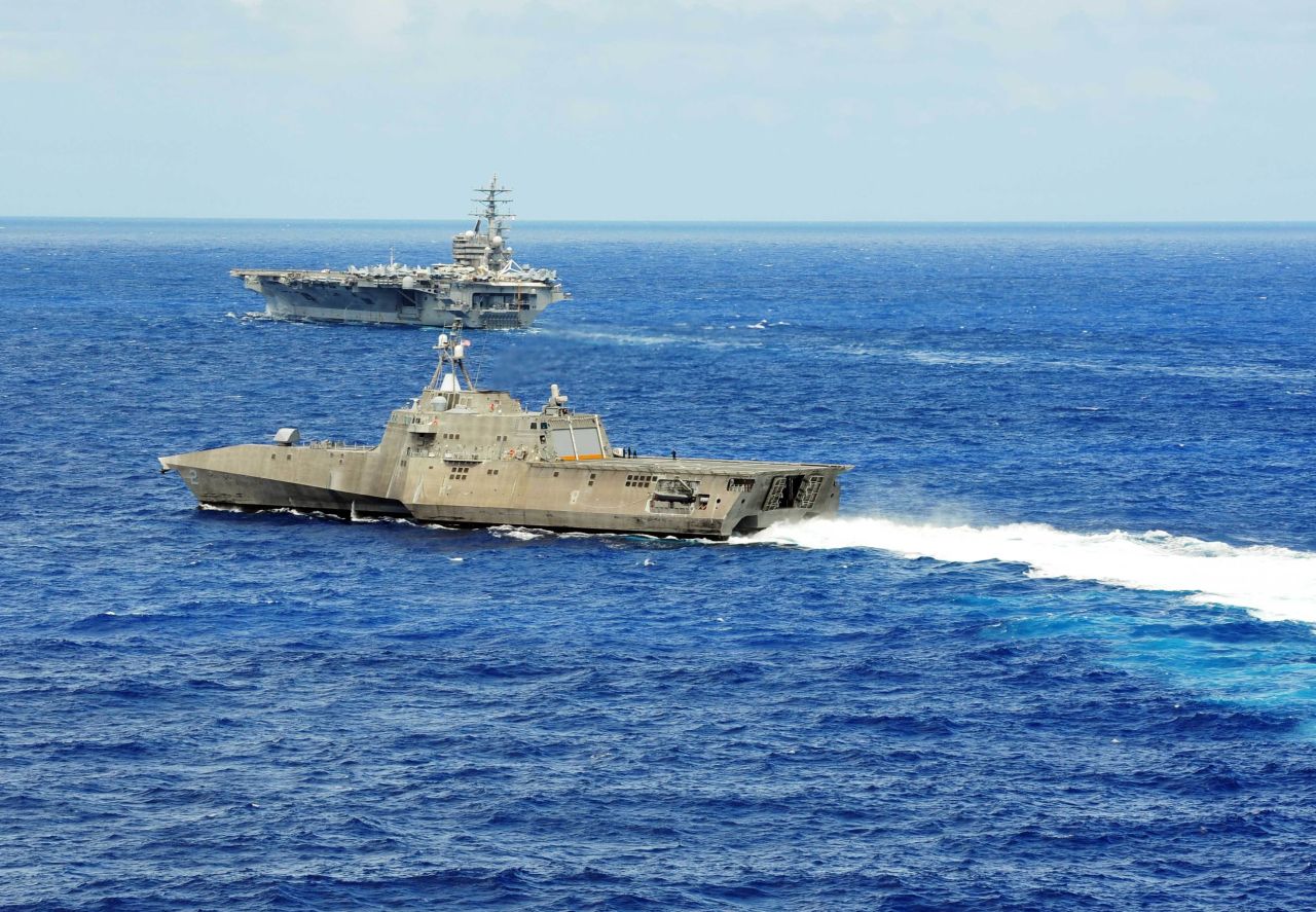 The littoral combat ship USS Independence (LCS 2) conducts maneuvers with the aircraft carrier USS Ronald Reagan (CVN 76) during Rim of the Pacific (RIMPAC) Exercise 2014.