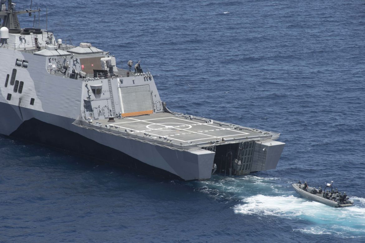 A rigid-hull inflatable boat prepares to enter the littoral combat ship USS Freedom (LCS 1) during training off the coast of Southern California.  