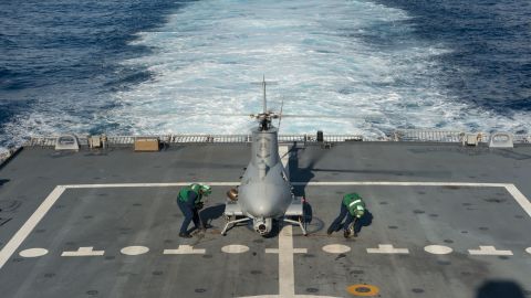 Sailors assigned to Helicopter Maritime Strike Squadron (HSM) 35 prepare an MQ-8B Fire Scout unmanned aircraft system for flight operations aboard the littoral combat ship USS Fort Worth (LCS 3).