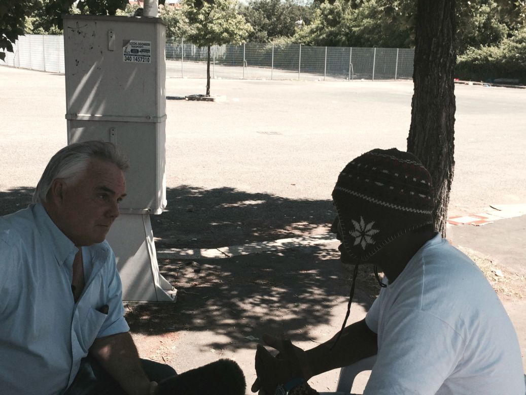 CNN International correspondent Ben Wedeman (L) with Benjamin, an Eritrean migrant in a park in Ponte Mammolo in northern Rome. He was one of a very few migrants in park who would agree to an interview. 