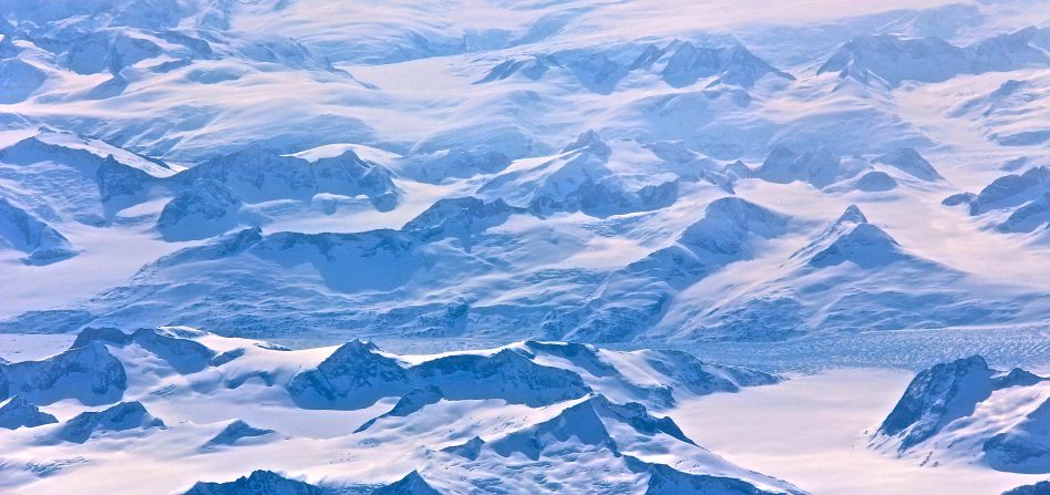 Virginia resident Richard Gornik took these photos while flying over Greenland, which he concedes is, not so green. "I was taken aback in seeing how desolate a landscape could be, and I sure would not want to be there on the ice," he says. 