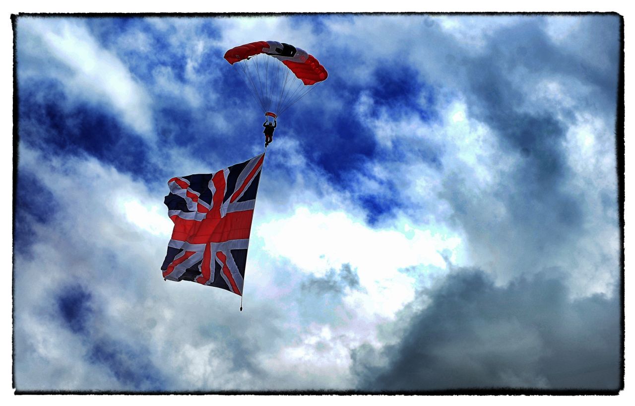 The Red Devils parachute team mark the start of the race as they swoop down on the course last year complete with a Union Jack.