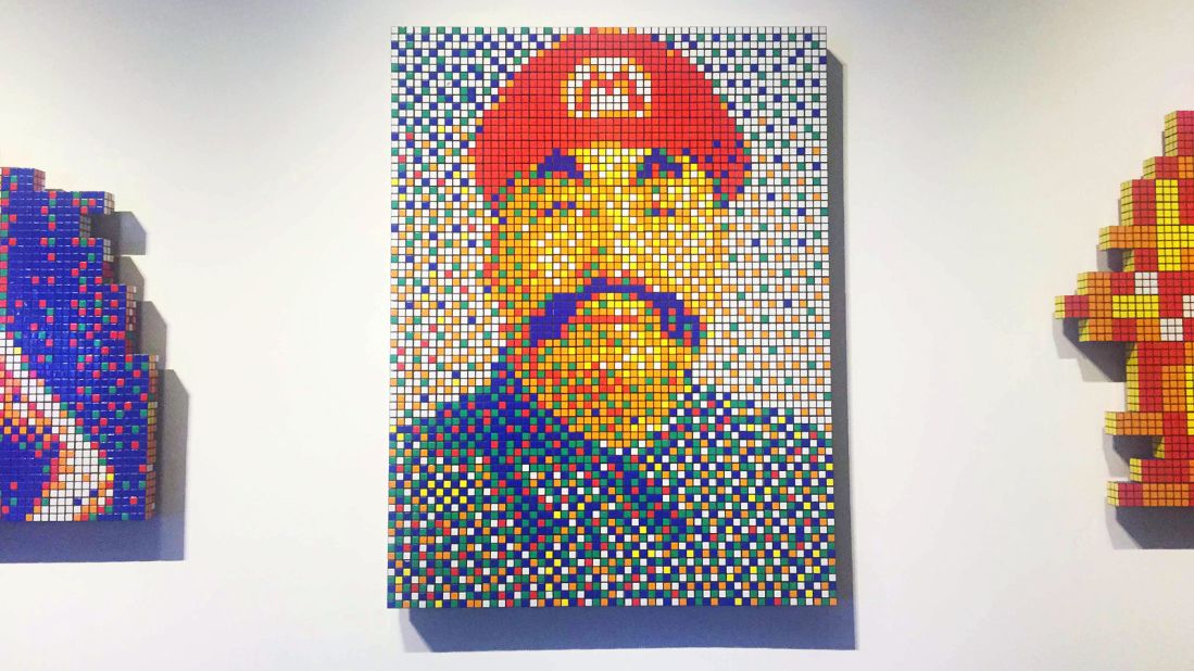 This work actually officially titled "Super Mao Zedong." Part of Invader's new "Rubikcubism" series --  works created using Rubik's Cubes. Each of the cubes is rotated a specific way for the right color to show. 