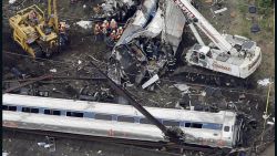 Emergency personnel work at the scene of a deadly train wreck, Wednesday, May 13, 2015, in Philadelphia. More than 200 people aboard the Washington-to-New York train were injured in the derailment that plunged screaming passengers into darkness and chaos Tuesday night. (AP Photo/Patrick Semansky)