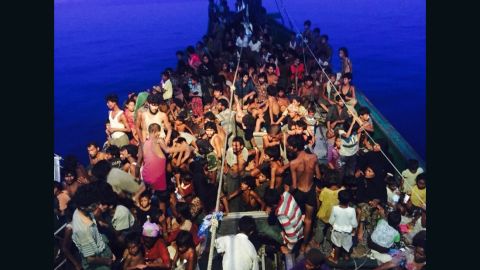 Hundreds of desperate Rohingya migrants are packed on a wooden boat that was spotted off Thailand's coast Thursday, May 14, 2015. 