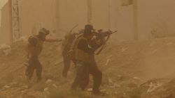 Security forces defend their headquarters against attacks by Islamic State extremists during sand storm in the eastern part of Ramadi, the capital of Anbar province, 115 kilometers (70 miles) west of Baghdad, Iraq, Thursday, May 14, 2015. Islamic State extremists tend to take advantage of bad weather when they attack Iraqi security forces positions, an Iraqi officer said. (AP Photo)