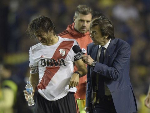 Midfielder Leonardo Ponzio was approached by a commentator on the pitch as he tried to wash out his eyes.