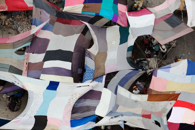 A covered market in Port au Prince, is a patchwork of colors when viewed from above.