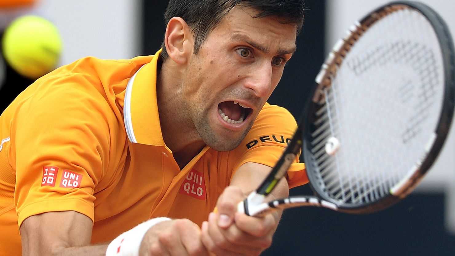 Novak Djokovic at full stretch during his semifinal win over David Ferrer at the Italian Open.