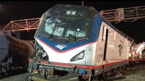 The windshield of the train may have been hit by something before the crash. The area of interest is the circular mark on the right side of the windshield.