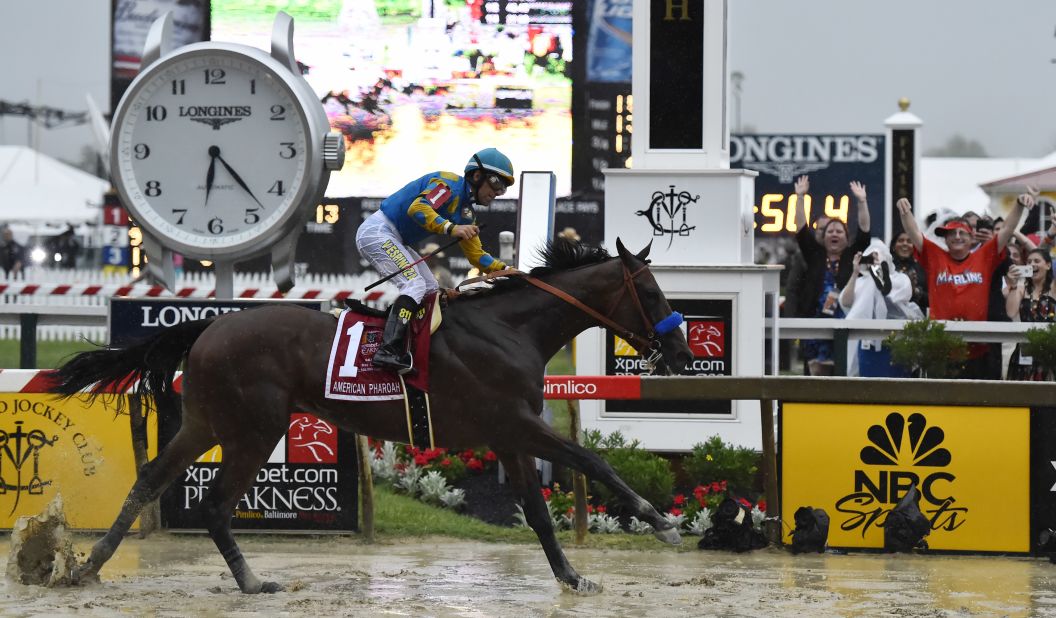 American Pharoah, ridden by Victor Espinoza, wins the Preakness Stakes to continue its quest for the coveted Triple Crown.