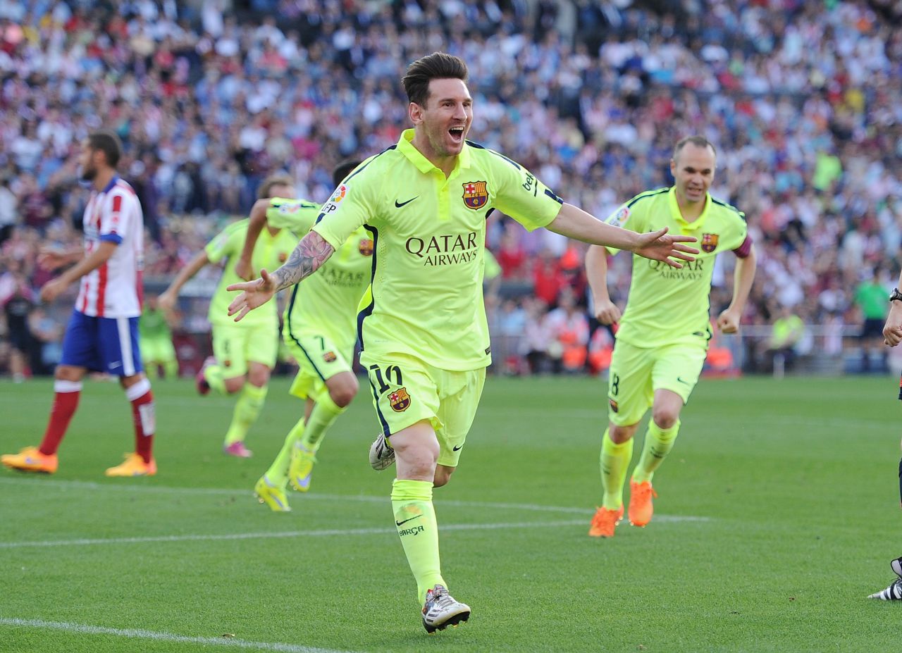 Messi wheels away to celebrate.
