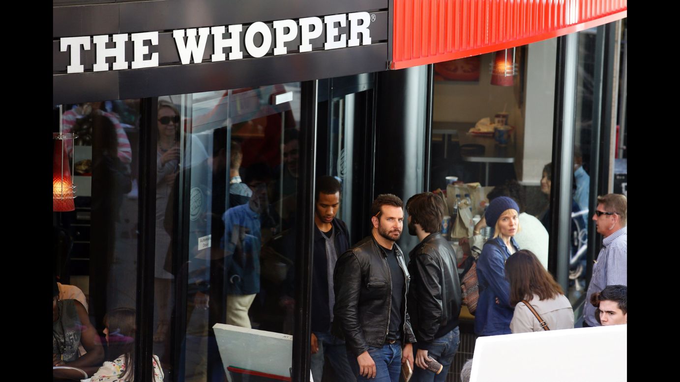 Bradley Cooper wasn't just stopping by a London Burger King for a Whopper run in July 2014. He was actually doing work -- and in more ways than one. <a href="http://www.eonline.com/news/564126/why-is-bradley-cooper-working-at-burger-king" target="_blank" target="_blank">According to E! News</a>, the Oscar nominee got behind the grill and learned how to flip burgers for a role in an upcoming movie. 