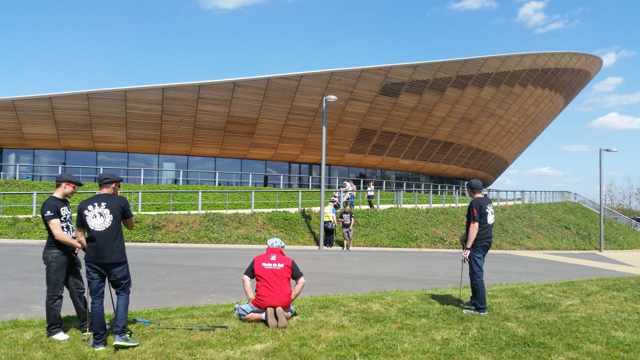The Olympic Velodrome served as the backdrop for the first tee. 
