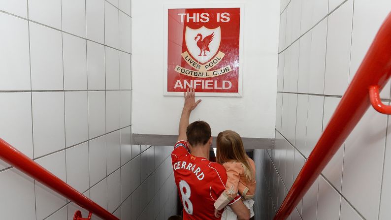 Liverpool's Steven Gerrard touches the famous "This is Anfield" sign before <a href="index.php?page=&url=http%3A%2F%2Fwww.cnn.com%2F2015%2F05%2F16%2Ffootball%2Ffootball-gerrard-liverpool-anfield%2F" target="_blank">playing his final home match</a> Saturday, May 16, in Liverpool, England. Gerrard's career will continue in the United States, where he'll play for the Los Angeles Galaxy. Gerrard played 17 seasons for Liverpool, appearing in more than 700 matches.