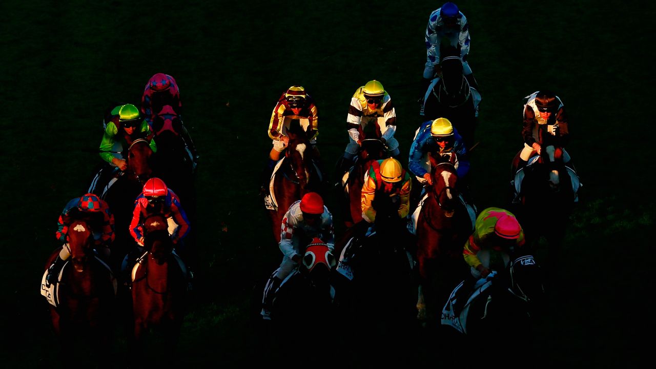 Horses bunch together as they race Saturday, May 16, at Caulfield Racecourse in Melbourne.