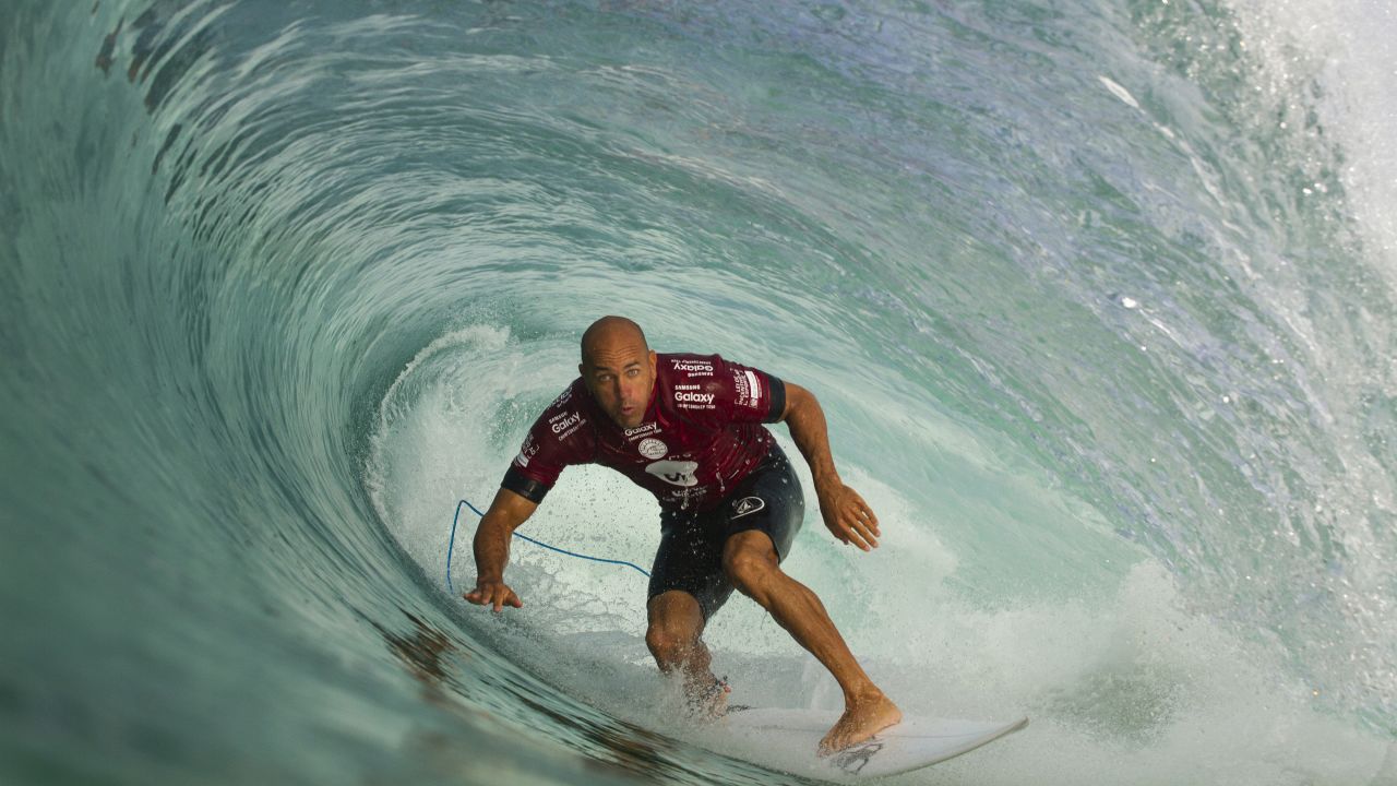 American surfer Kelly Slater ducks under a wave during a competition in Rio de Janeiro on Tuesday, May 12.