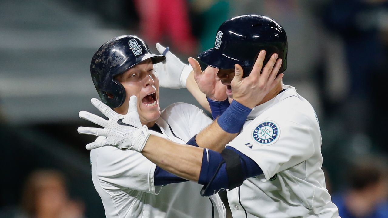 Seattle's Mike Zunino, right, is congratulated by teammate Logan Morrison after hitting a home run on Tuesday, May 12.