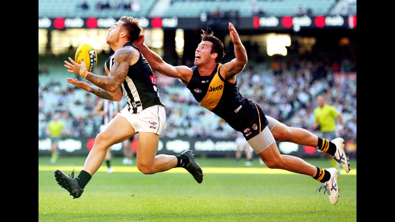 Jamie Elliott of the Collingwood Magpies takes a mark in front of Alex Rance of the Richmond Tigers during an Australian Football League match on Sunday, May 17.