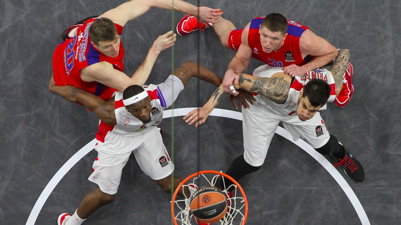 Olympiacos players box out two players from CSKA Moscow during their Euroleague Final Four game Friday, May 15, in Madrid. Olympiacos won 70-68 but lost in the final to Real Madrid.