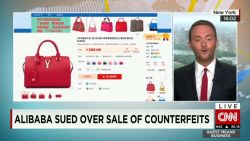 qmb alibaba sued over counterfeits_00003527.jpg