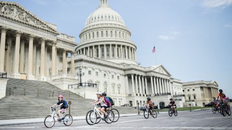 Children ride bikes past the Capitol building in Washington, D.C. which topped the list as the "Nation's Fittest City," according to the annual American Fitness Index. 