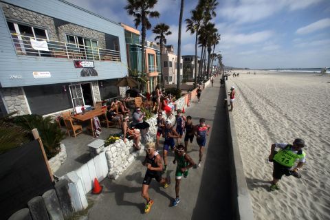 Competitors run on the boardwalk during a triathlon San Diego, ranked third on the list.