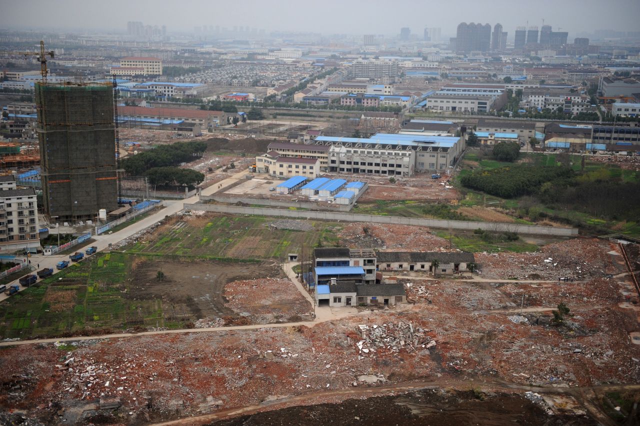 The Yao home is the last one standing in the rubble of a vast development site.