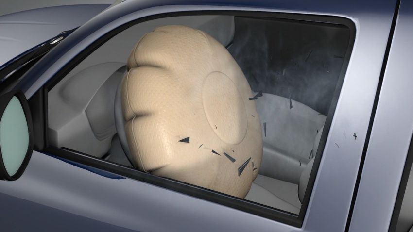 This graphic from the Insurance Institute for Highway Safety shows an airbag expanding, shooting shrapnel toward the driver.