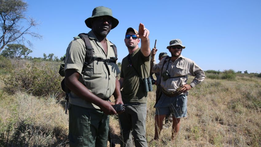 Corey Knowlton, center, hunts a black rhino in Namibia.