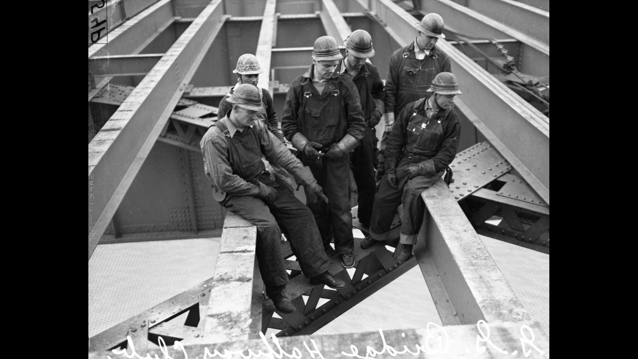 This portrait shows members of the bridge's "Halfway to Hell Club" -- workers who had tumbled off the bridge but were saved by the safety netting below. Despite the netting, 11 workers died during the bridge's construction. Ten of them perished when a section of scaffold fell through the netting.