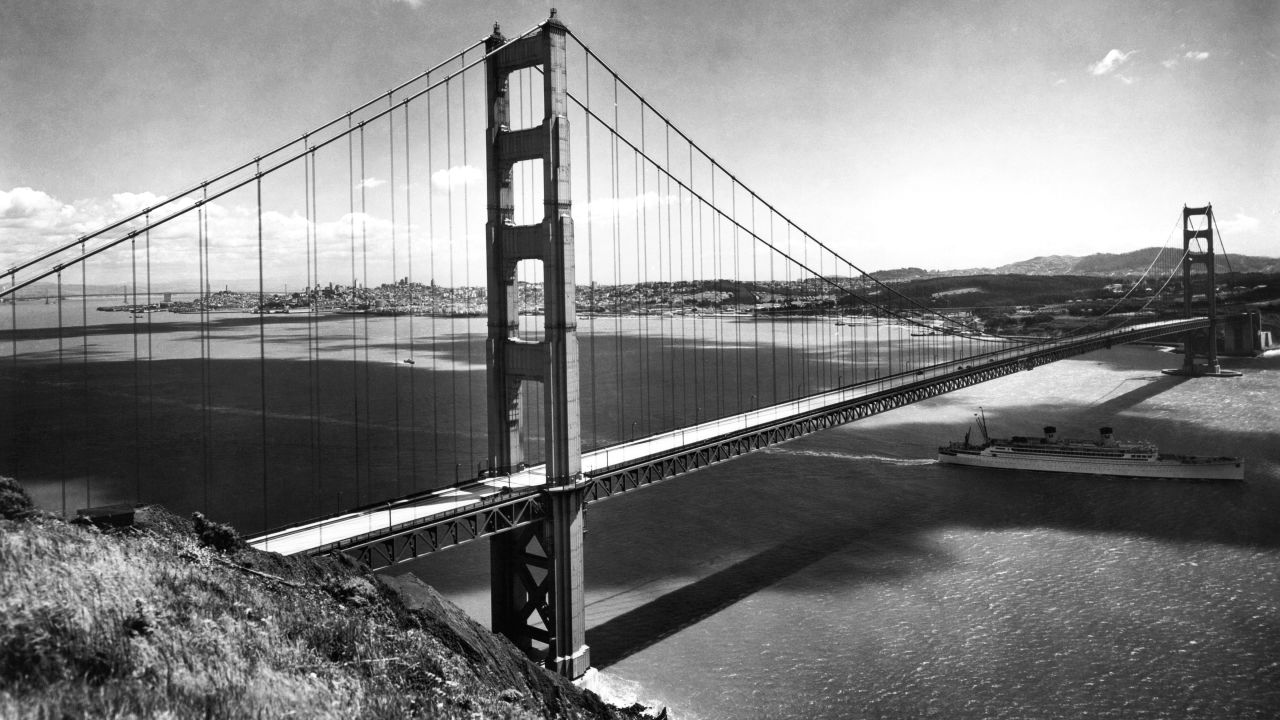 A Matson Liner passes under the Golden Gate Bridge on its way out to sea in the late 1930s. The American Society of Civil Engineers named the bridge one of the "Wonders of the Modern World." Since its completion, the bridge has been crossed by more than 2 billion vehicles and closed because of weather conditions only three times.