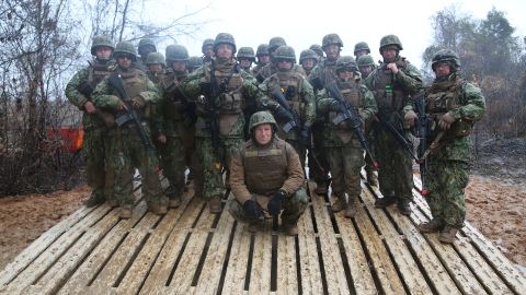 CNN's Mike Rowe poses with Navy Seabees in Hattiesburg, Mississippi, for "Somebody's Gotta Do It."