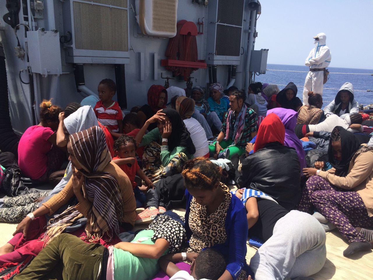 Rescuing the migrants is an "extraordinarily complex process," Amanpour reported.<br /><br />"It takes quite a long time to rescue boat of 300 people. They have to check, they have to make sure that there's nothing hostile on board."<br /><br />"Then all the naval personnel suit up in white hazardous material suits with masks and gloves -- we all had to do the same thing -- in order to make sure that you don't get contaminated by any potential disease."