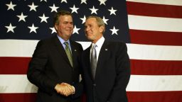 US President George W. Bush (R) shakes hands with his brother Florida Governor Jeb Bush during a fund-raising event at the PGA National Resort & Spa in Palm Beach Gardens, Florida, 08 January 2004.