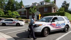 Washington police secure the vicinity around the fire-damaged multimillion-dollar home in northwest Washington, Wednesday, May 20, 2015, where four people were found dead May 14. Washington Police Chief Cathy Lanier earlier identified two of the victims found dead as 46-year-old Savvas Savopoulos and his 47-year-old wife, Amy Savopoulos. Police believe the other two victims are the couple's 10-year-old son and a housekeeper. Police say the deaths are being investigated as a homicide. . (AP Photo/Manuel Balce Ceneta)