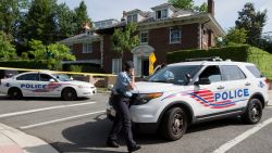 Washington police secure the vicinity around the fire-damaged multimillion-dollar home in northwest Washington, Wednesday, May 20, 2015, where four people were found dead May 14. Washington Police Chief Cathy Lanier earlier identified two of the victims found dead as 46-year-old Savvas Savopoulos and his 47-year-old wife, Amy Savopoulos. Police believe the other two victims are the couple's 10-year-old son and a housekeeper. Police say the deaths are being investigated as a homicide. .   (AP Photo/Manuel Balce Ceneta)