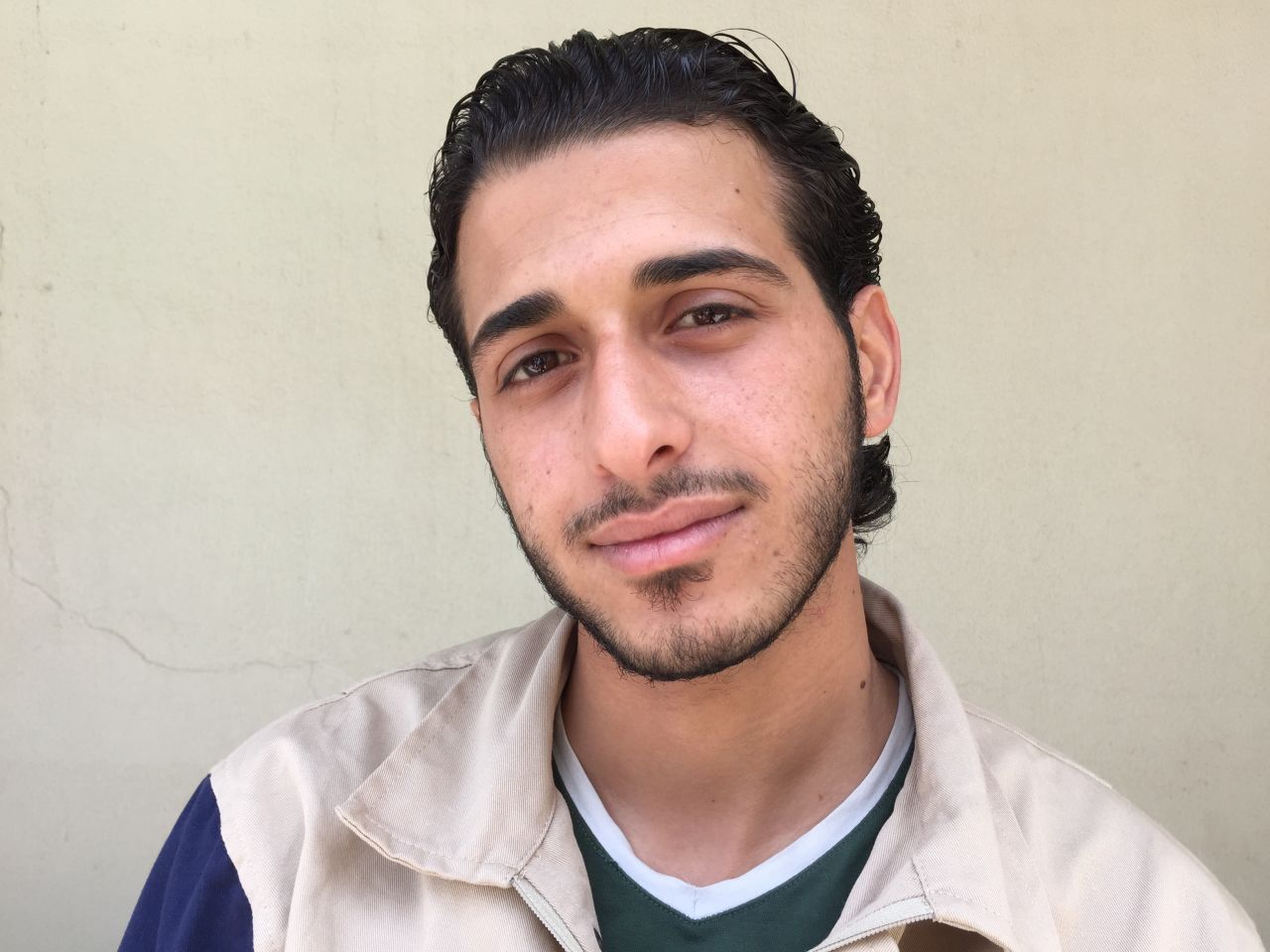 Mohammad Altouma, 22. First-year university student, studying mechanical aviation engineering. "The town square in my village was bombed by the regime. It hit my uncle's house. I rescued my aunt, uncle and 5-year-old girl cousin, but her two brothers were killed."