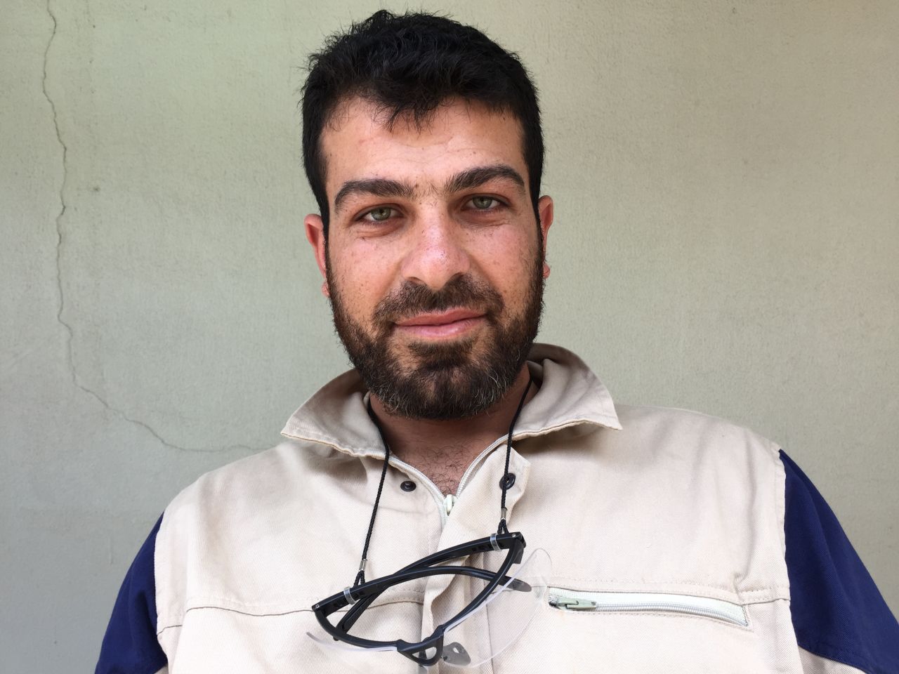 Isa Mohammad Jalloul, 25. Policeman and law student. "We responded to a bombing in a small village and ran to the basement. It was full of 15 women and children. 13 were dead, but we were able to save two, a man and a woman both in their twenties."