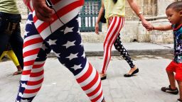 Women wearing pants designed with the colors of the U.S. flag walk through Old Havana in Cuba on January 30.