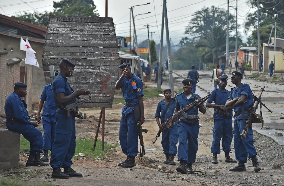 Police officers hold a position in Bujumbura on Wednesday, May 20.