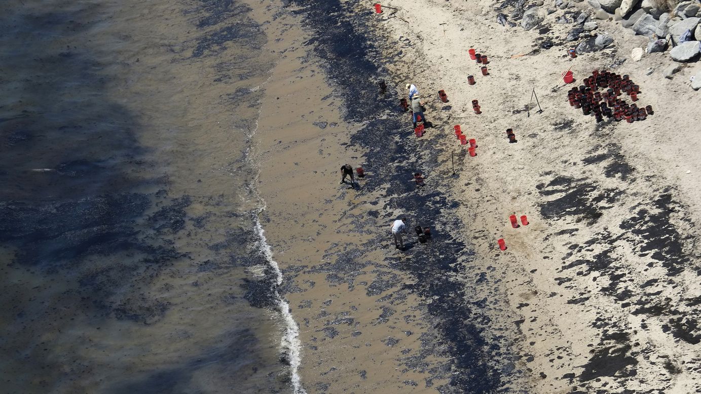 Volunteers fill buckets with oil near Refugio State Beach after <a href="http://www.cnn.com/2015/05/20/us/gallery/california-oil-spill/index.html" target="_blank">an oil spill north of Goleta, California,</a> on Wednesday, May 20. More than 100,000 gallons of oil spilled from a ruptured pipeline along the Santa Barbara coast. The cause of the rupture is still under investigation.