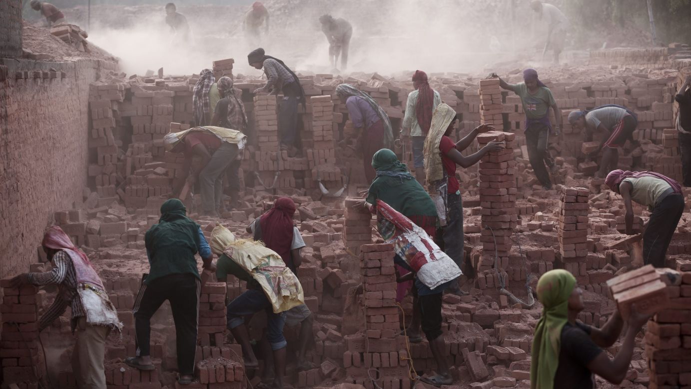 Laborers work at a brick factory in Bhaktapur, Nepal, on Tuesday, May 19. Nepal is facing an acute brick crisis after some 40 million houses -- and 80% of the country's brick kilns -- were damaged in two recent earthquakes.