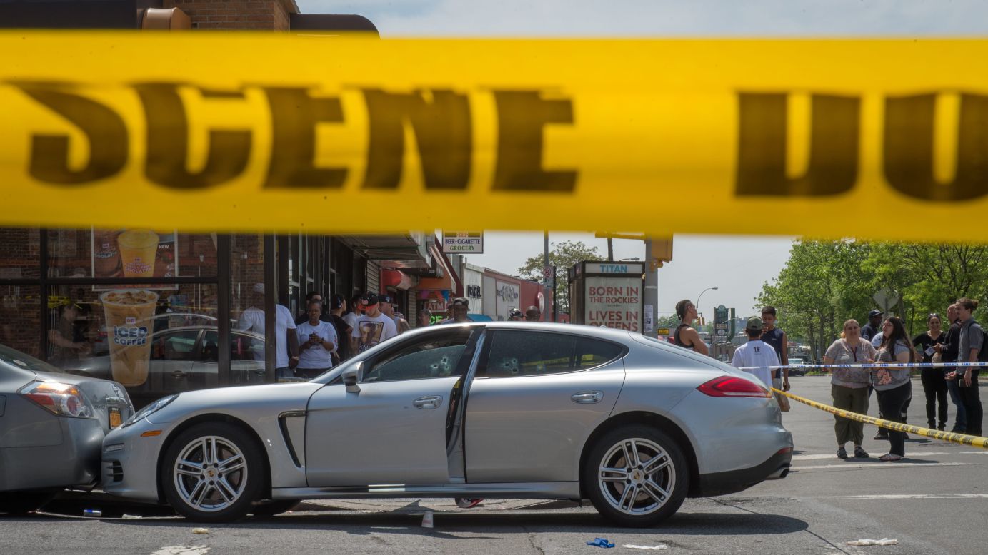 People in New York gather at the scene where up-and-coming rapper Lionel Pickens, known by the stage name Chinx, <a href="http://www.cnn.com/2015/05/17/entertainment/chinx-rapper-death-feat/" target="_blank">was shot and killed</a> on Sunday, May 17.